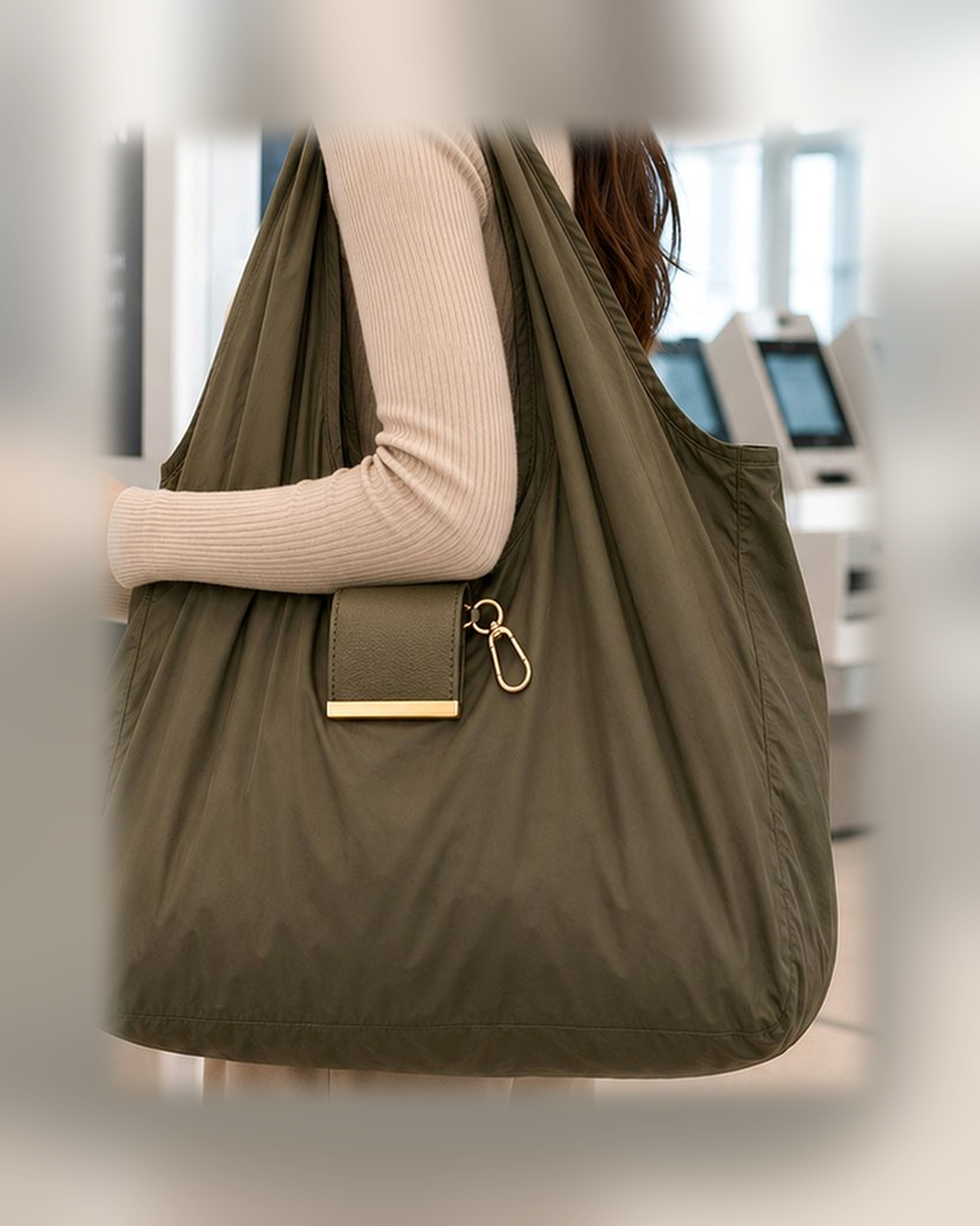 TAWY clipped to a handbag and carried as a tote
